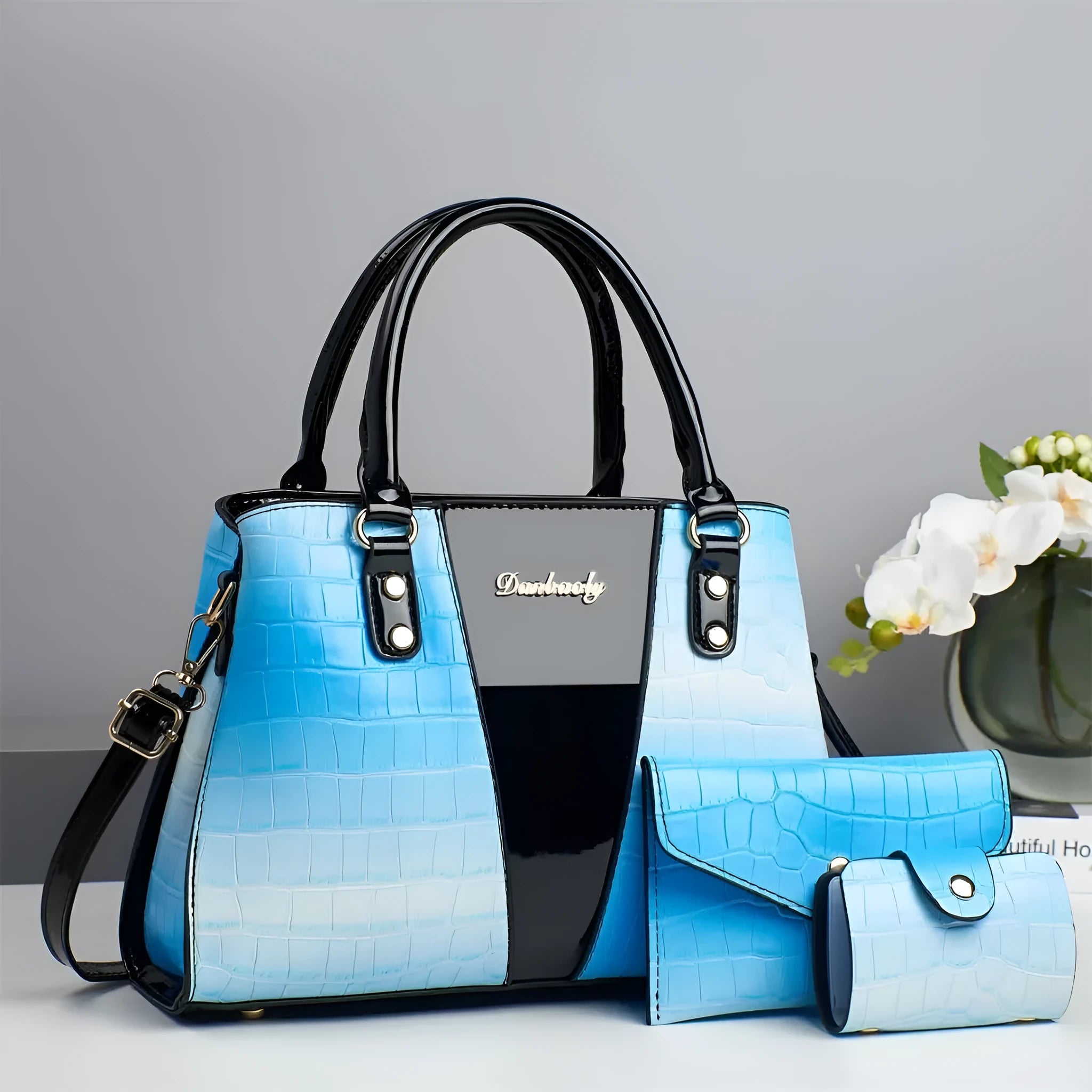 Women's crocodile stitch three-piece shoulder bag set in PU leather showing main bag and two smaller bags