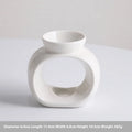 White Nordic minimalist ceramic aromatherapy stove ornament for indoor fragrance diffusion.