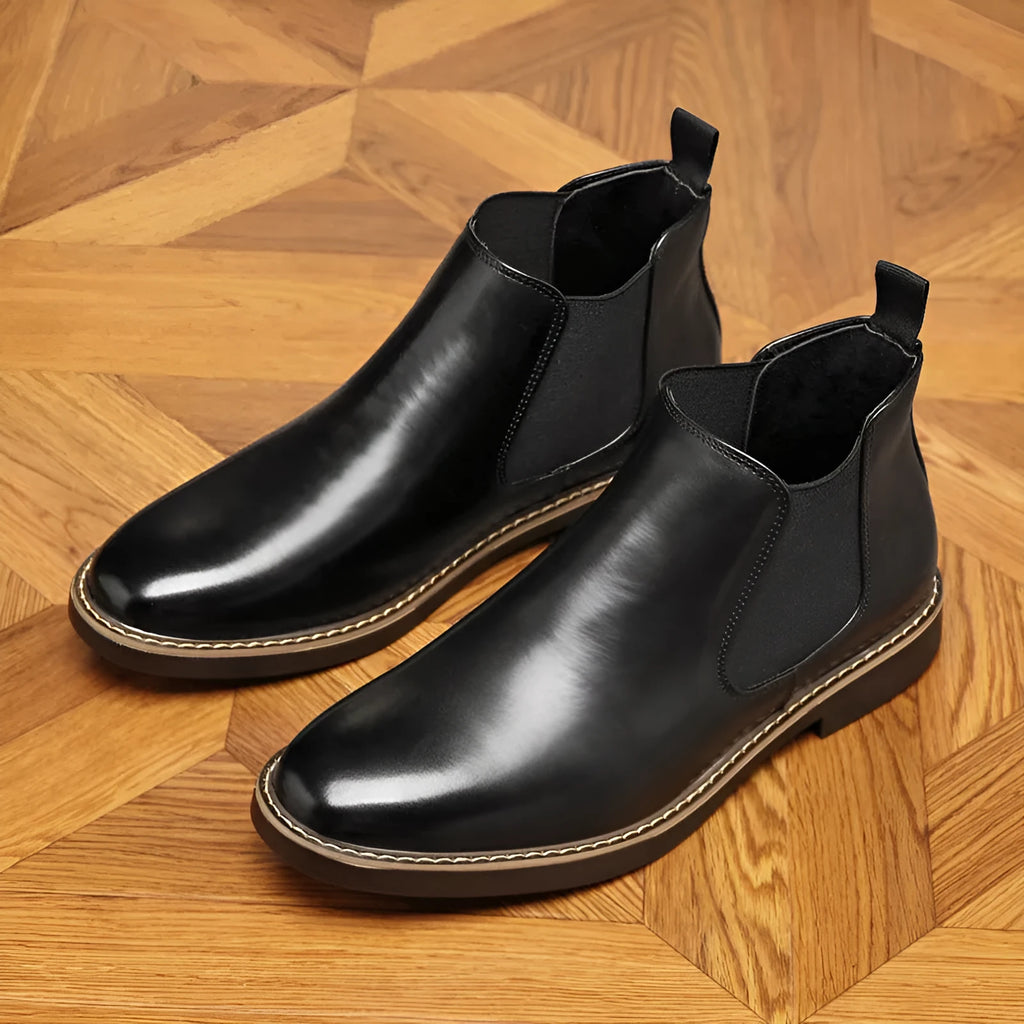 Men's black formal leather boots with a pointed toe and square heel on a non-slip rubber sole.