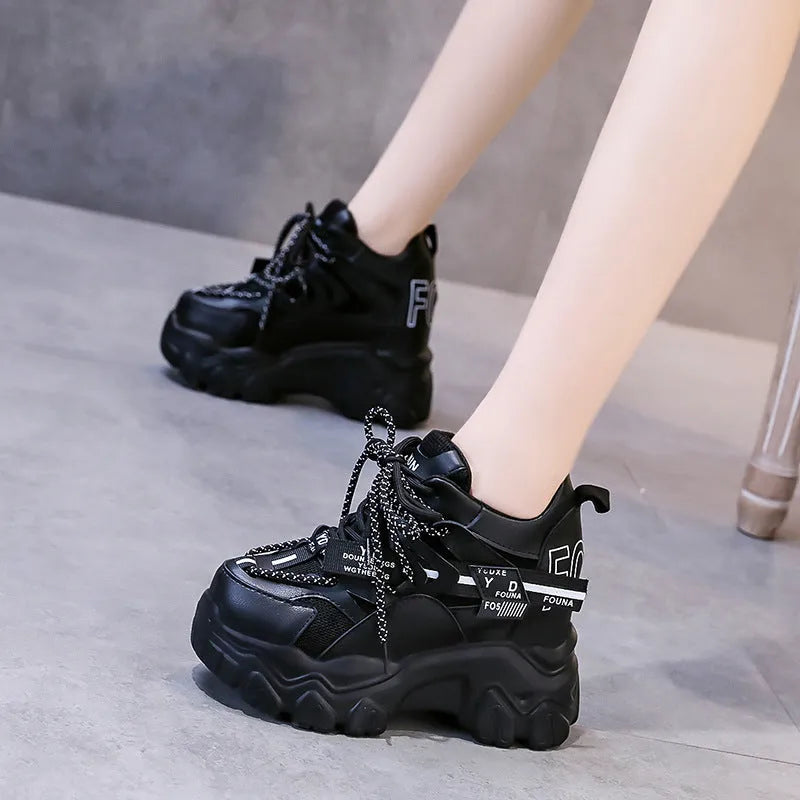 White women's low-top platform sports shoes with breathable mesh, cross strap, and rubber sole.
