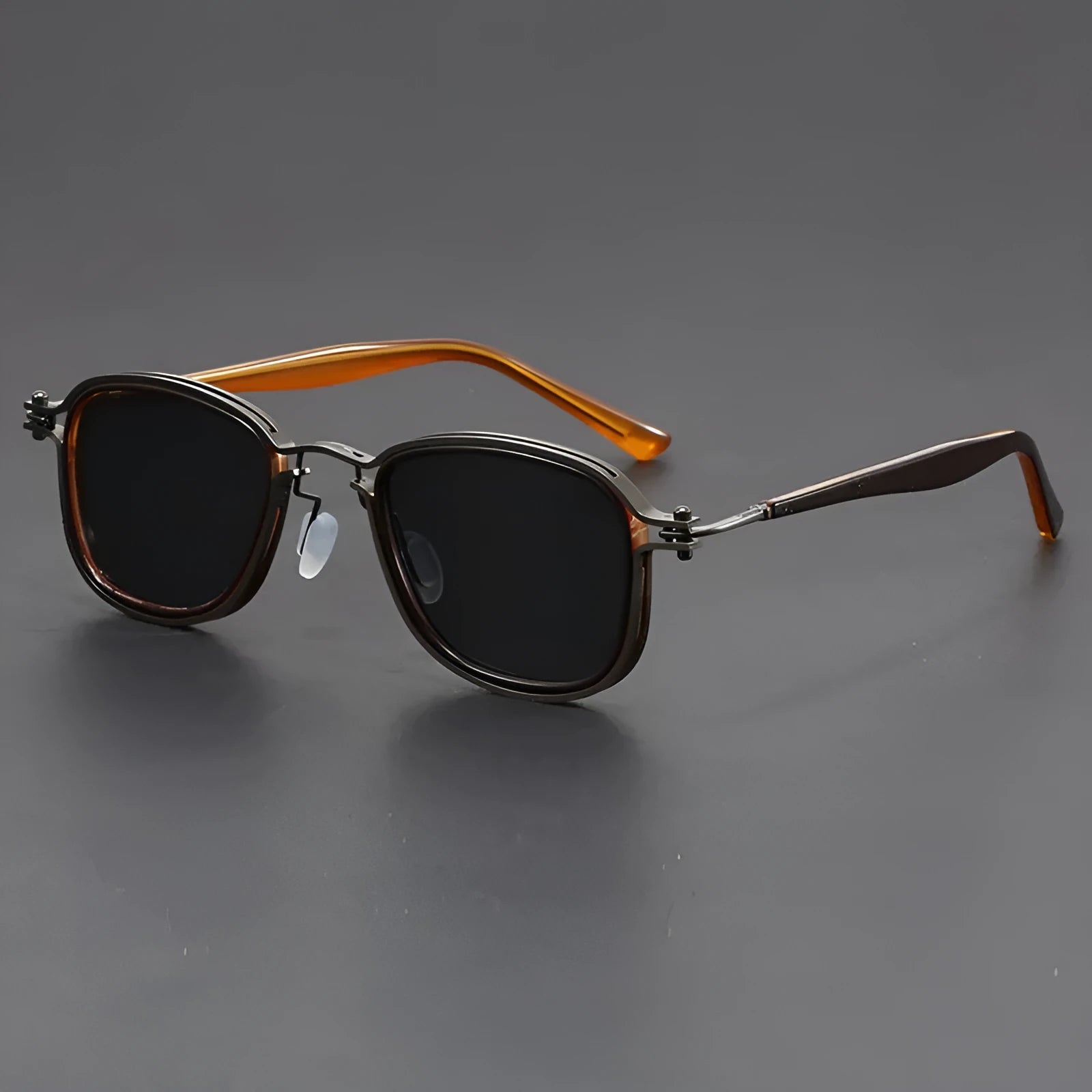 Retro style square sunglasses with a mixed metal and plastic frame and AC lenses.