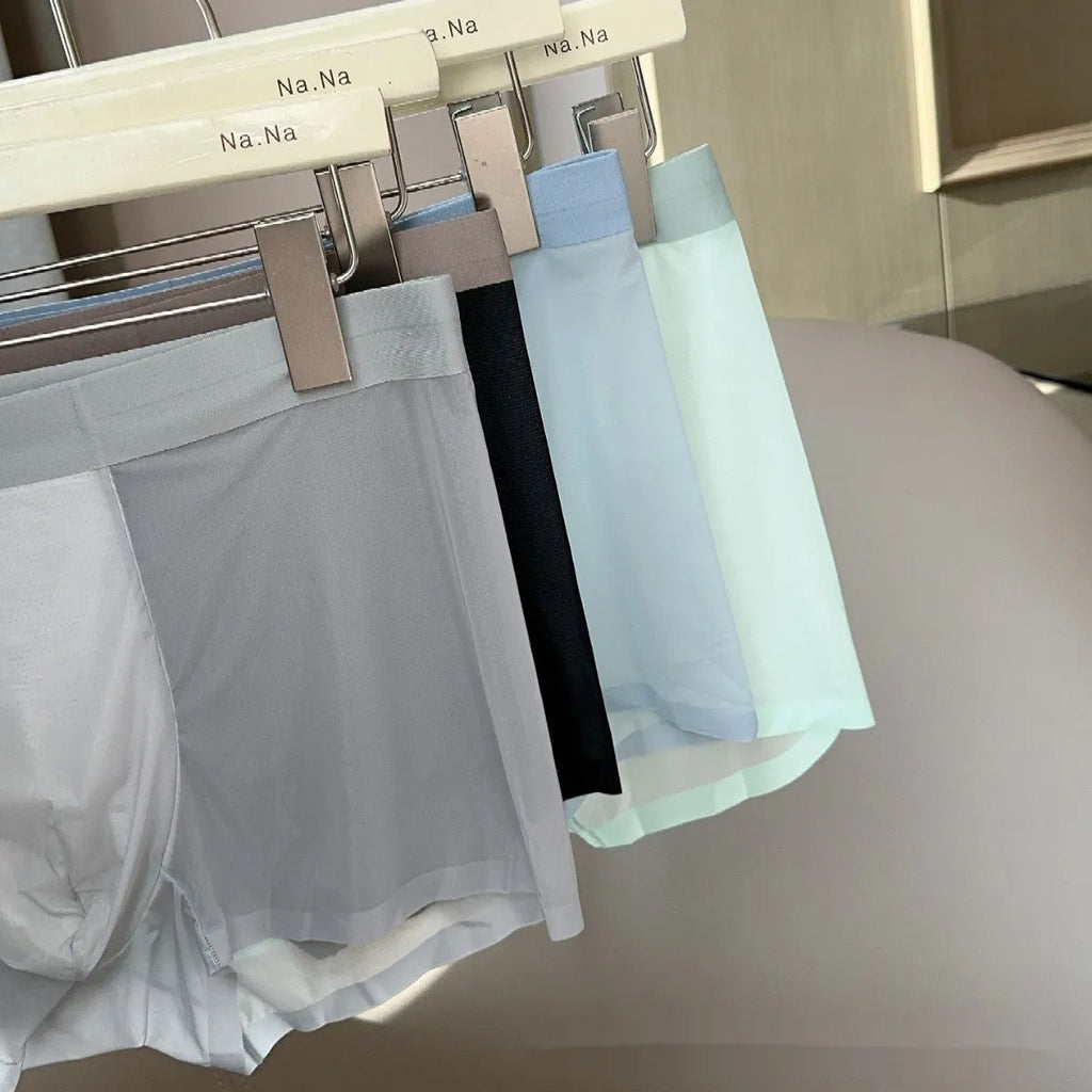 Seamless men's boxer in ice silk fabric showing honeycomb crotch design and mid waist.
