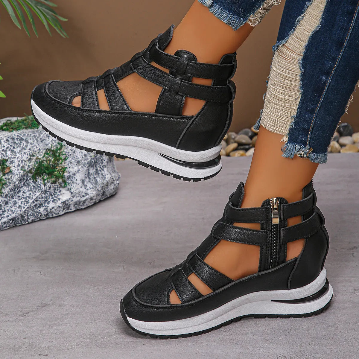 Women's black close-toed hollow-out platform sandals with Velcro strap on a white background