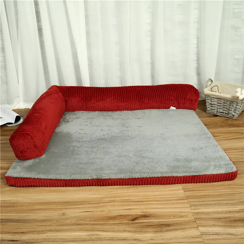 Corduroy bolster dog bed in grey, showing bilateral raised sides and non-slip base.