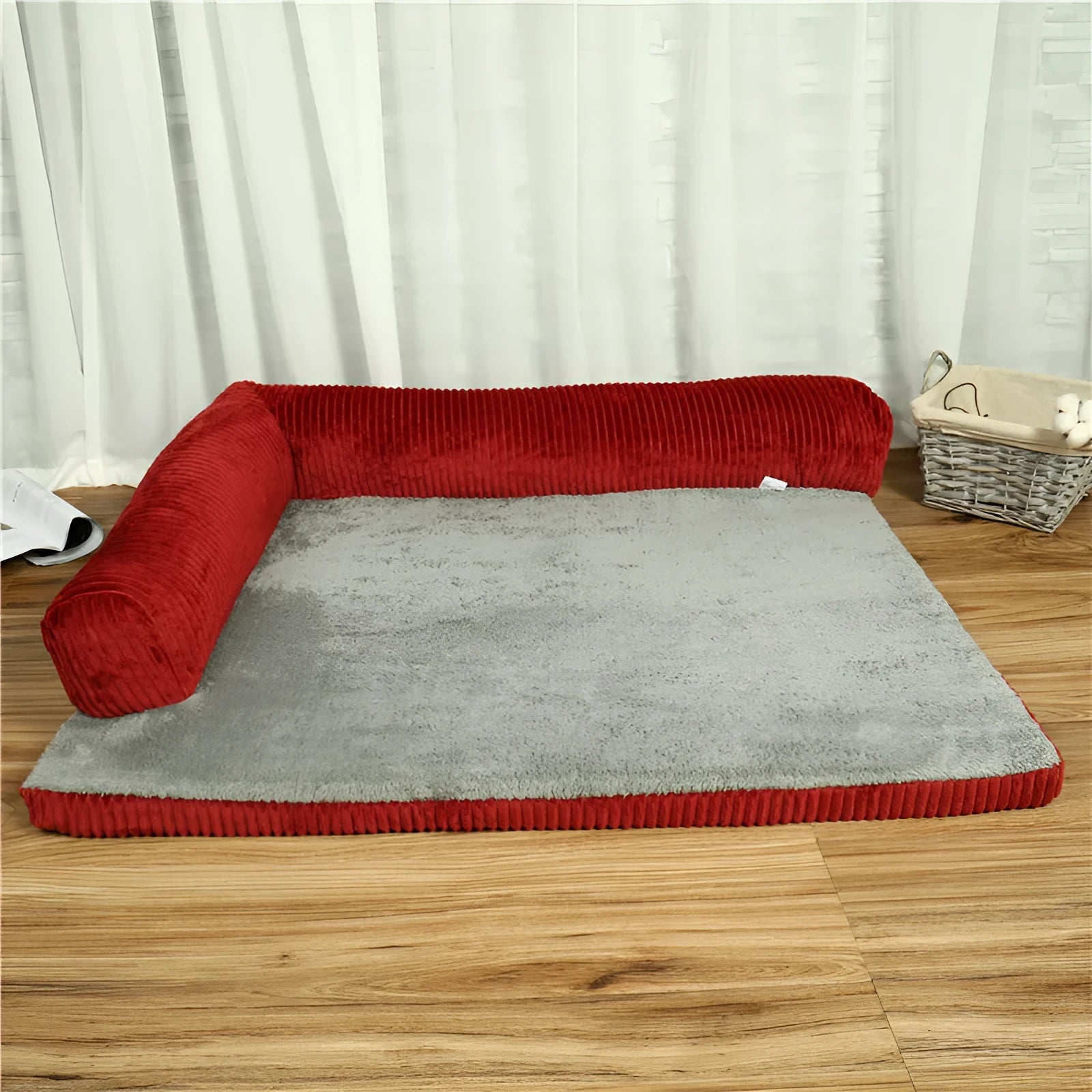 Corduroy bolster dog bed in grey, showing bilateral raised sides and non-slip base.