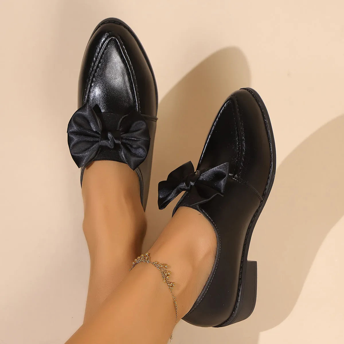 Women's British-style leather shoes with decorative bow on pointed toe, available in three bow style variations