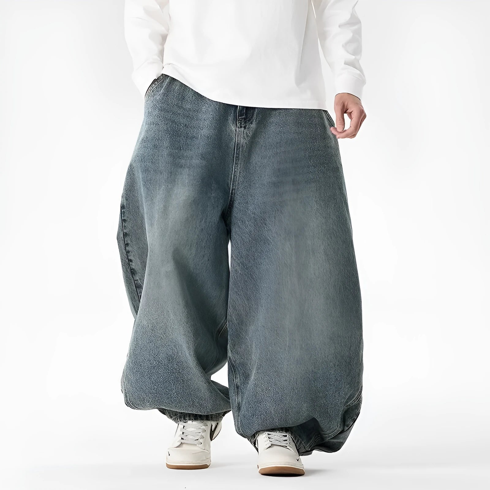 Men's plus size baggy wide leg jeans in light blue denim laid flat