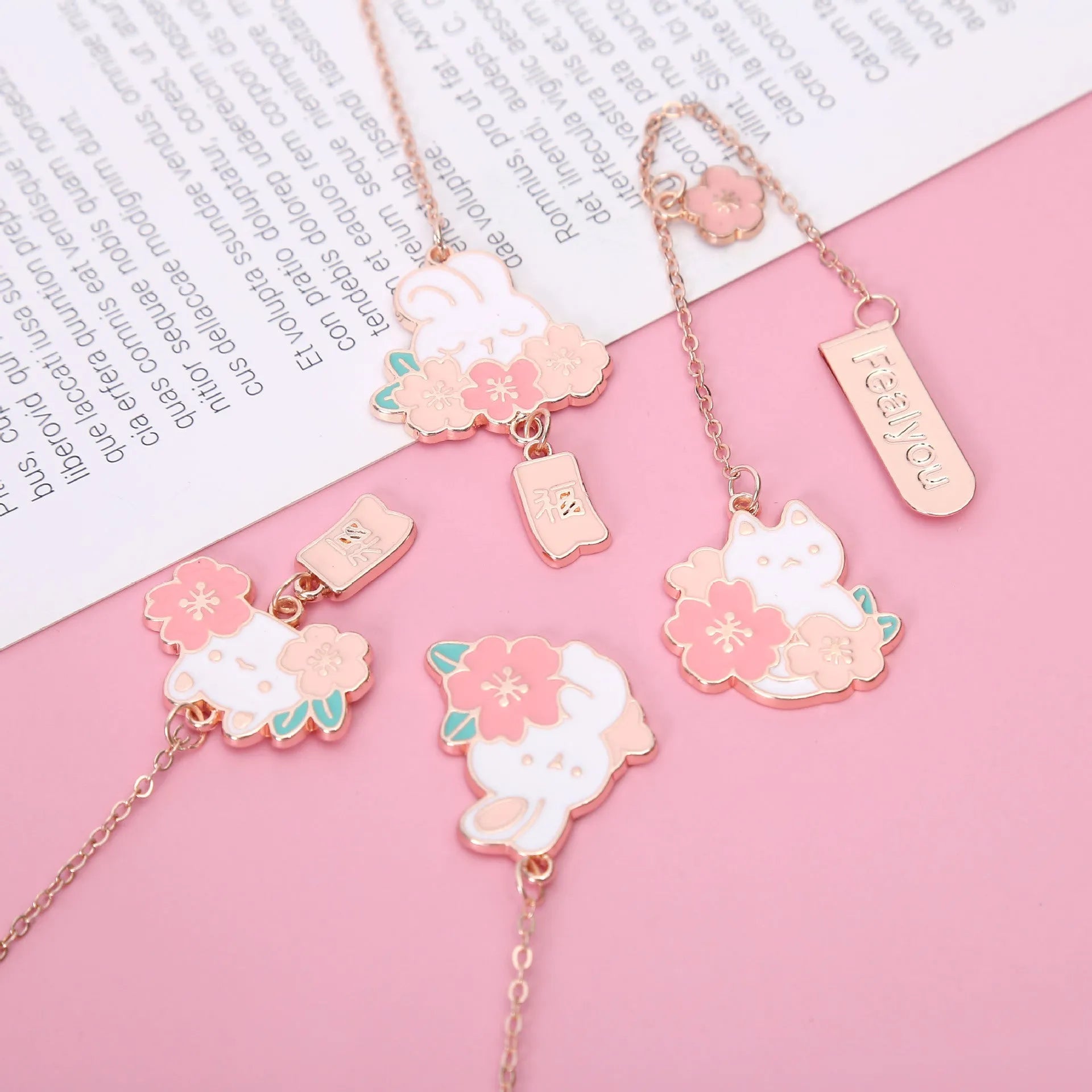 Creative cartoon metal pendant bookmark featuring cherry blossom cat and rabbit designs.