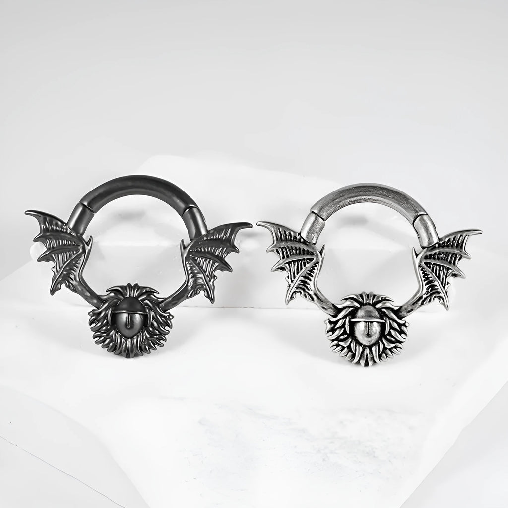 Copper geometric cone-shaped magnetic ear stretcher plugs with round magnetic closure on ear lobe.