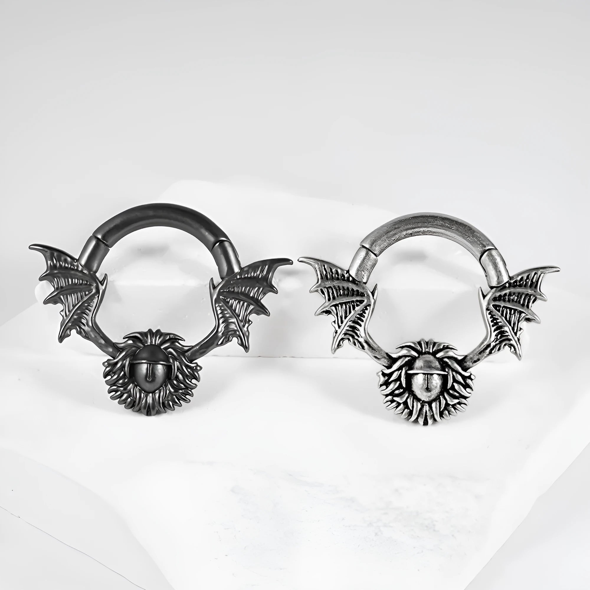 Copper geometric cone-shaped magnetic ear stretcher plugs with round magnetic closure on ear lobe.