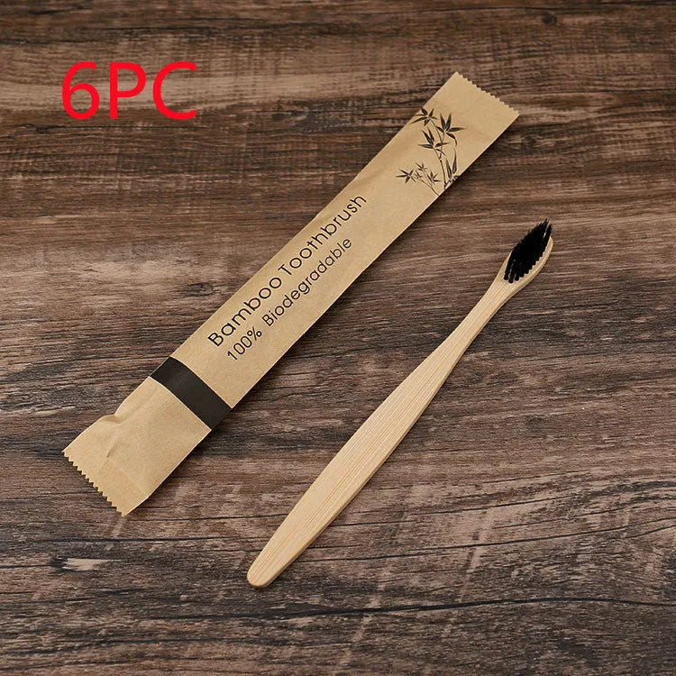 Set of ten bamboo toothbrushes with charcoal-infused bristles in assorted colours on a white background.