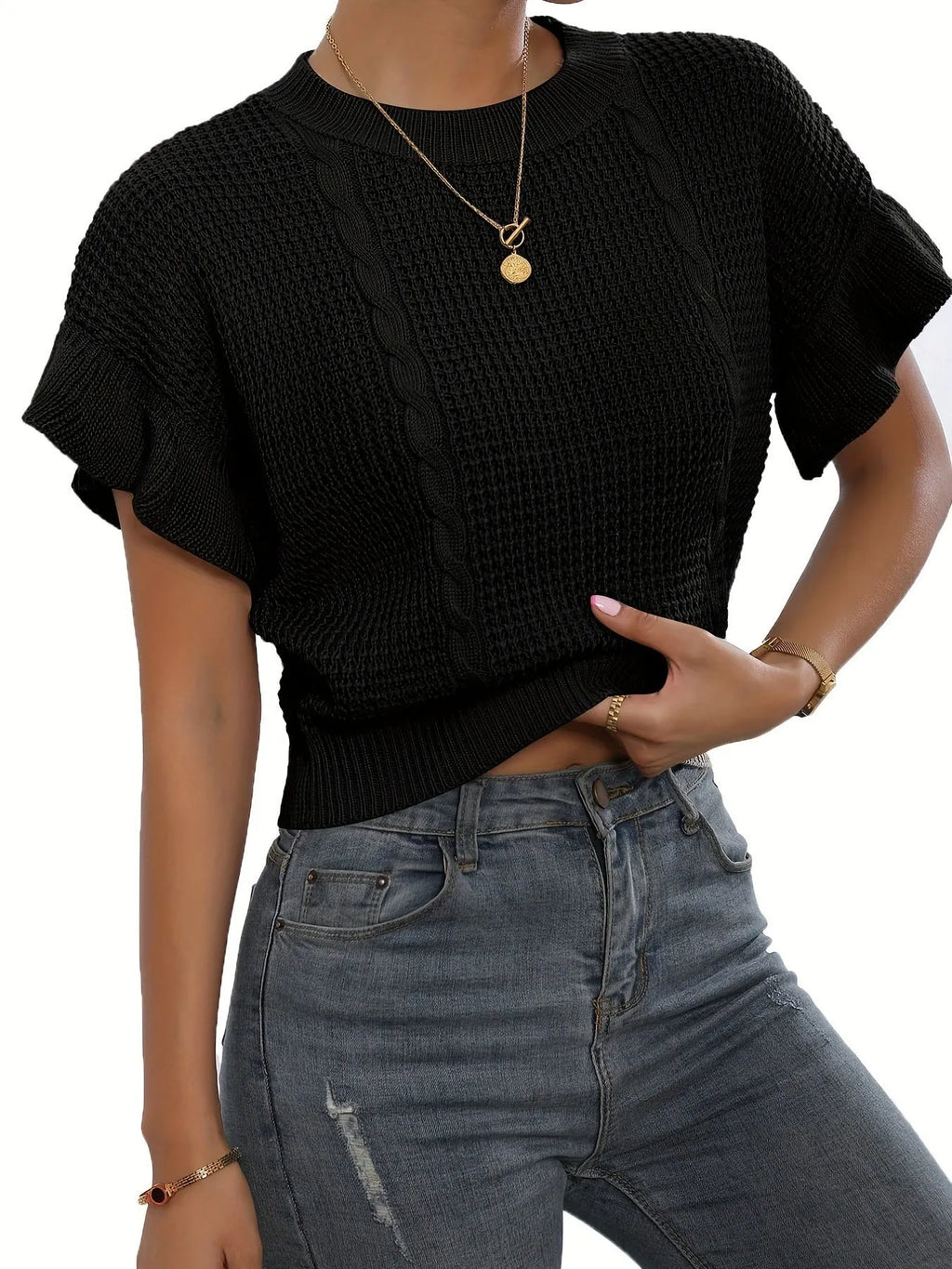 White loose knitted women's pullover sweater with ruffled short sleeves and a textured 3D pattern.