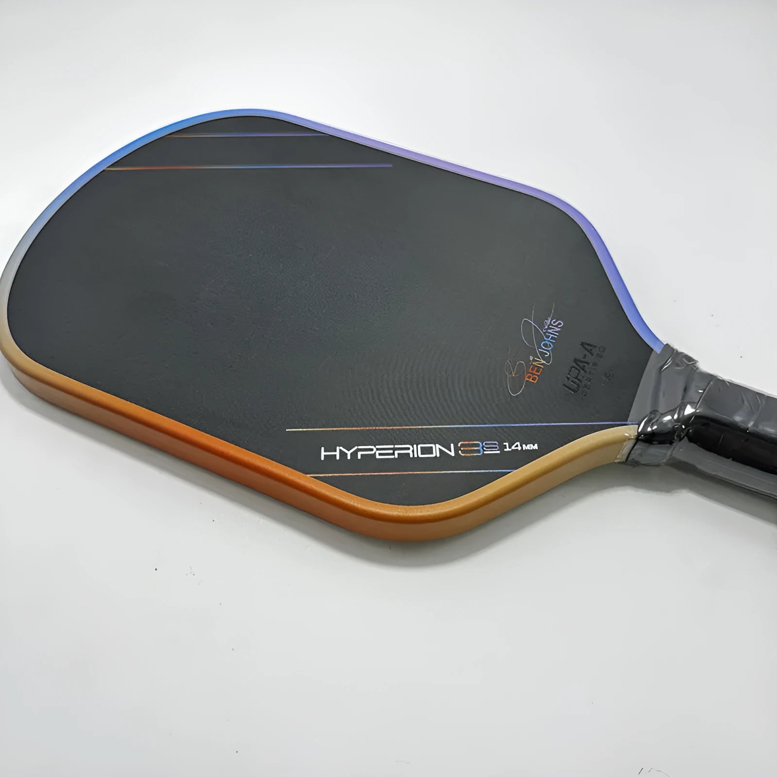 Aurora multicolour T700 carbon fibre pickleball racket with matte finish and honeycomb core.