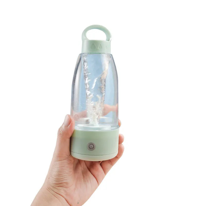 Green automatic electric shaker bottle with USB port, handle, and 380ml capacity.