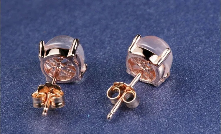 Rose gold coloured drop shaped stud earrings with synthetic ross quartz crystal inlay, Korean style design