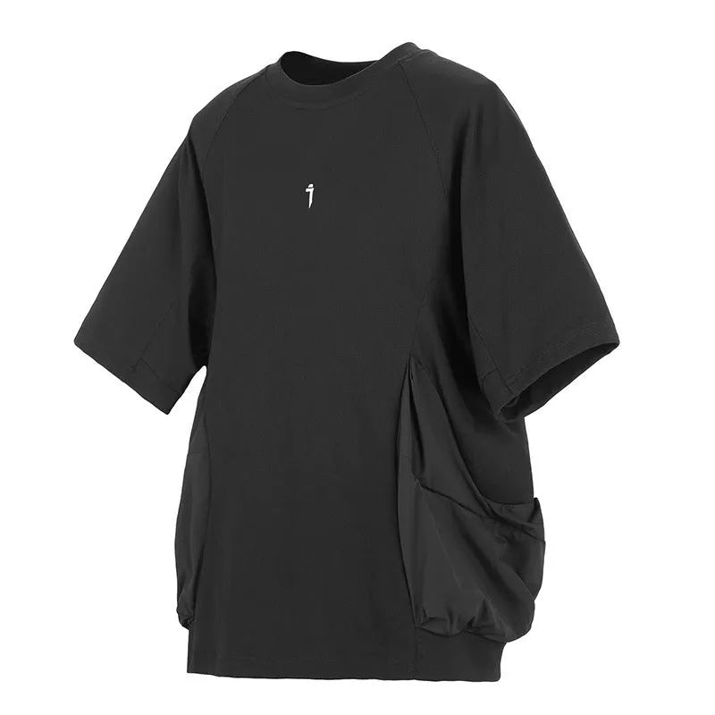 Men's loose fit grey cotton t-shirt with big chest pockets, short sleeves, and a round neck.