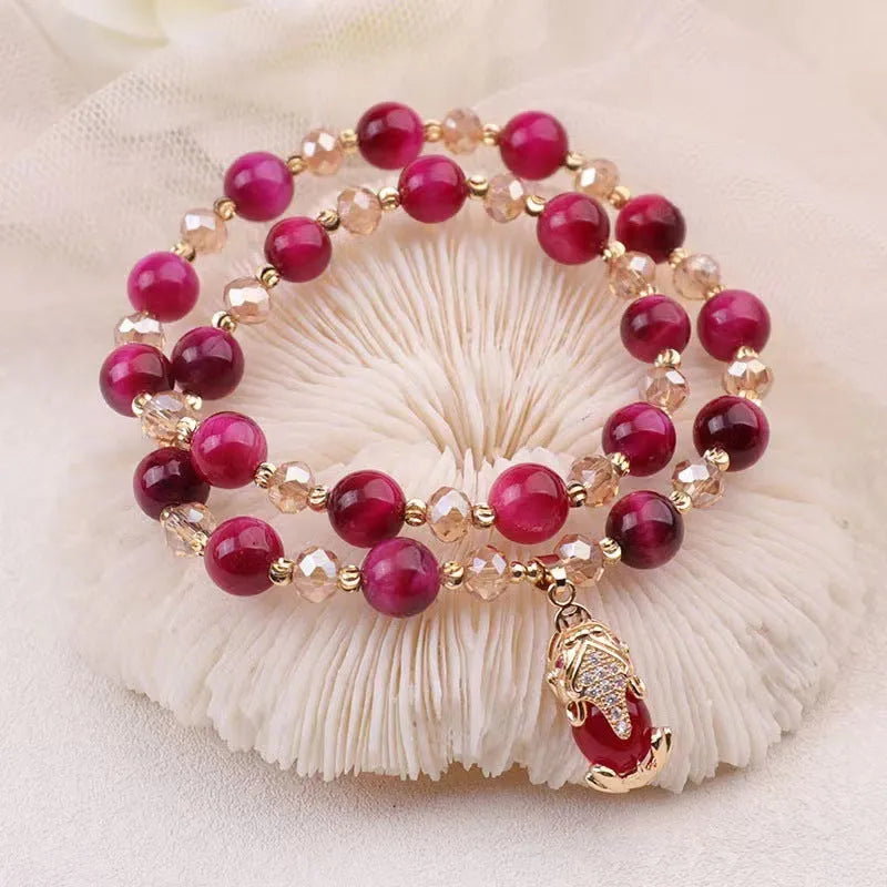 Handmade natural Tigereye stone bracelet with Vanves stone centre, shown in single and double chain designs.