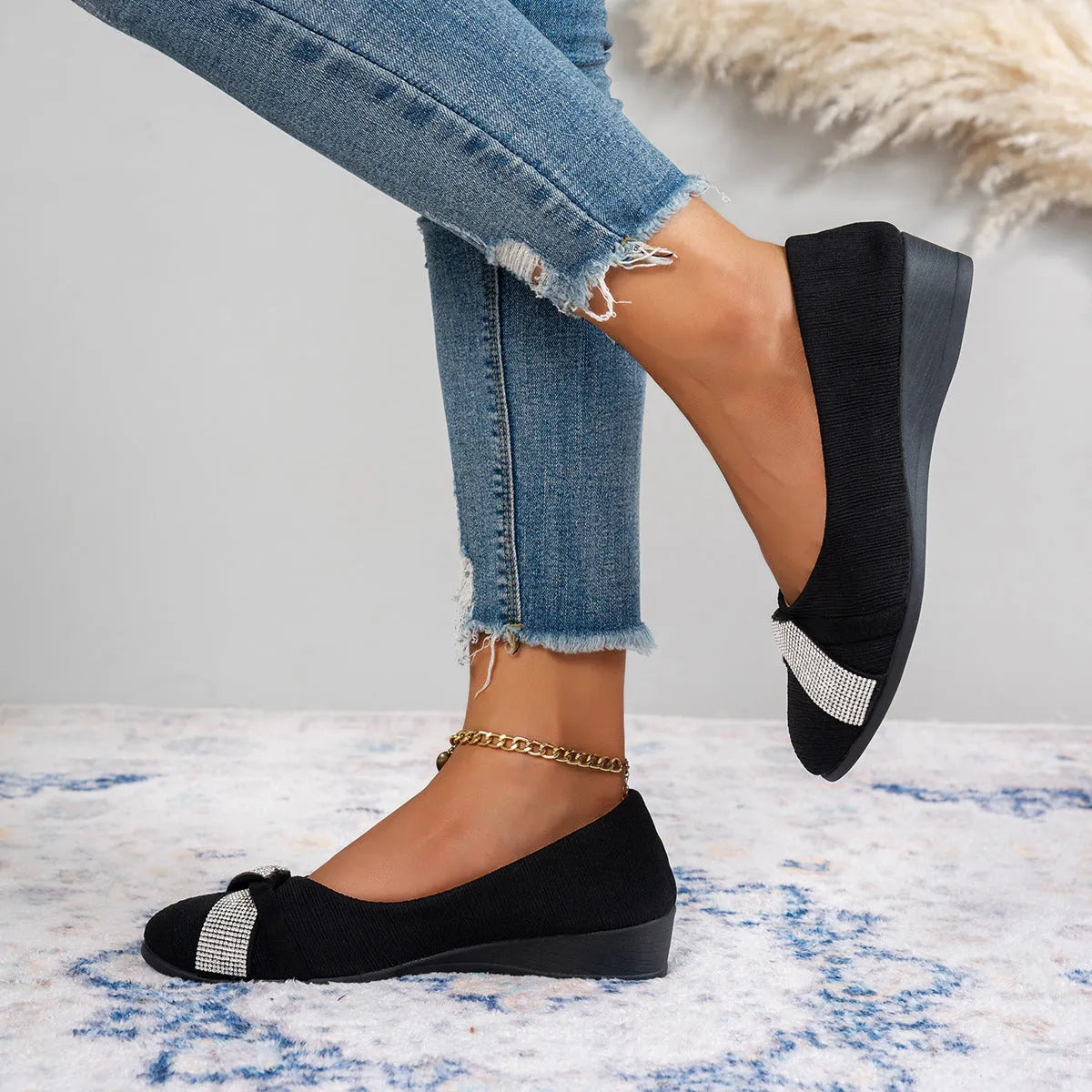 Black women's slip-on casual shoes with a chunky heel and rhinestone decoration on the fabric upper.