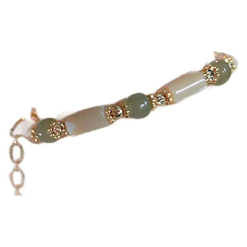 Hetian jade white lip shell bracelet with geometric round design on wrist