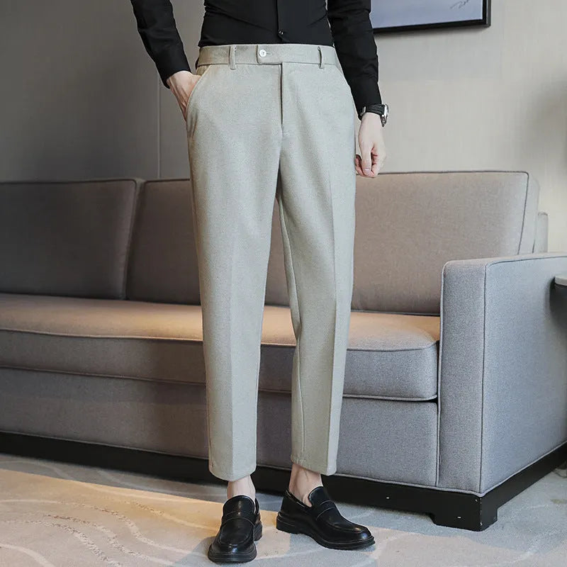 Men's straight fit brown corduroy trousers with elastic waistband on hanger