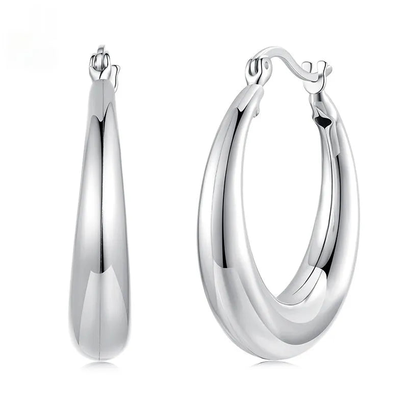 Women's geometric ring clip earrings in silver finish, available in three sizes