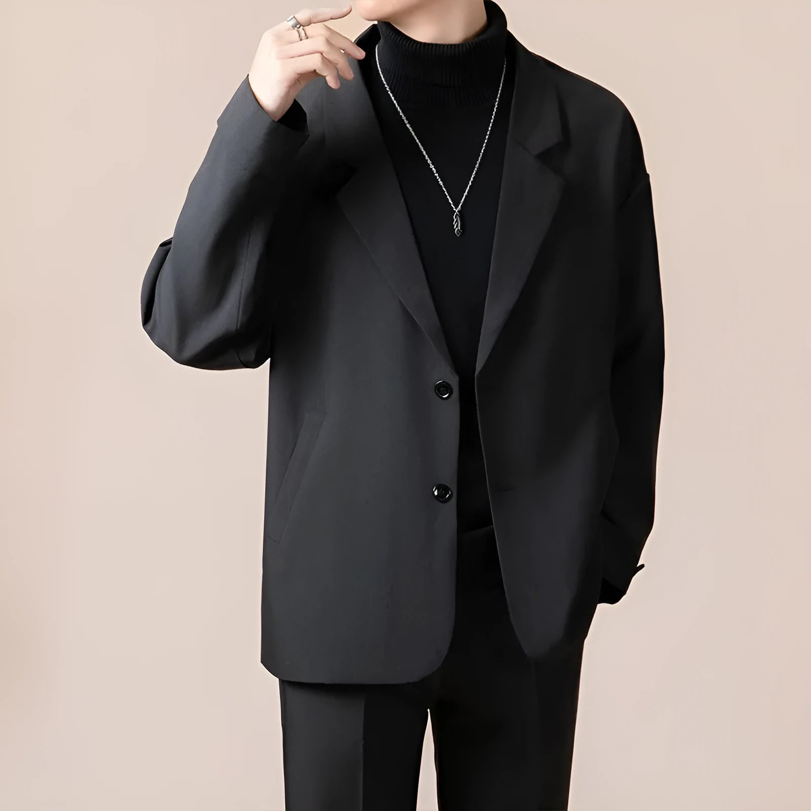 Loose fit light business suit jacket in chemical fibre blend fabric showing regular length and long sleeve design