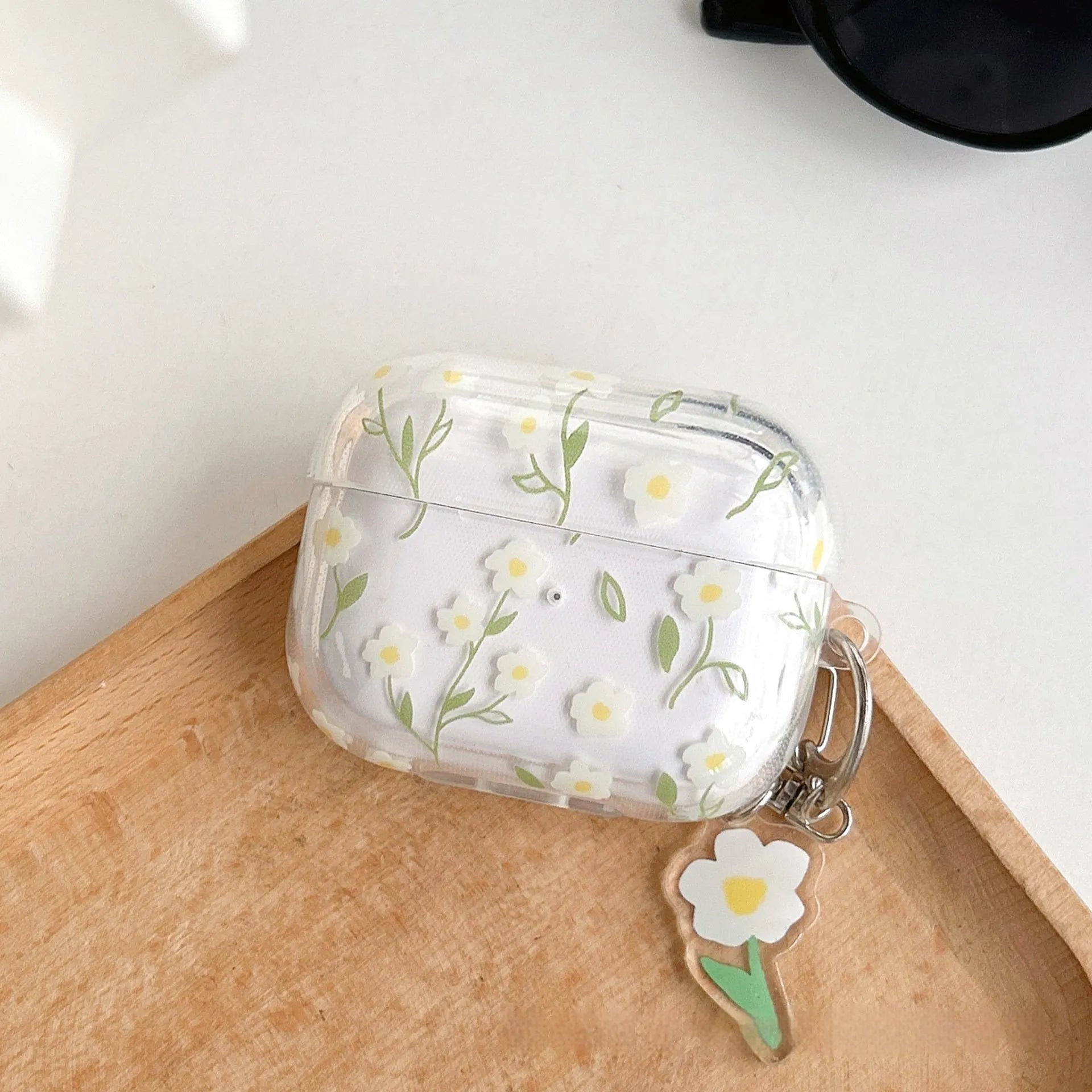 Clear soft TPU protective case for Apple AirPods with white floral oil painting decoration.
