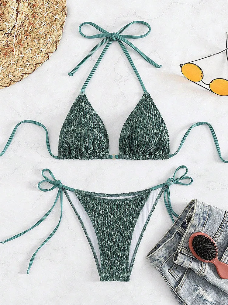 Women's green halter strap backless swimsuit set with three-point design and matching shorts