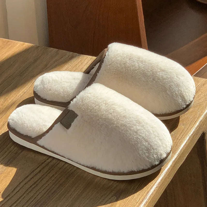Winter plush slippers in solid colours with non-slip PVC soles and car stitching detail