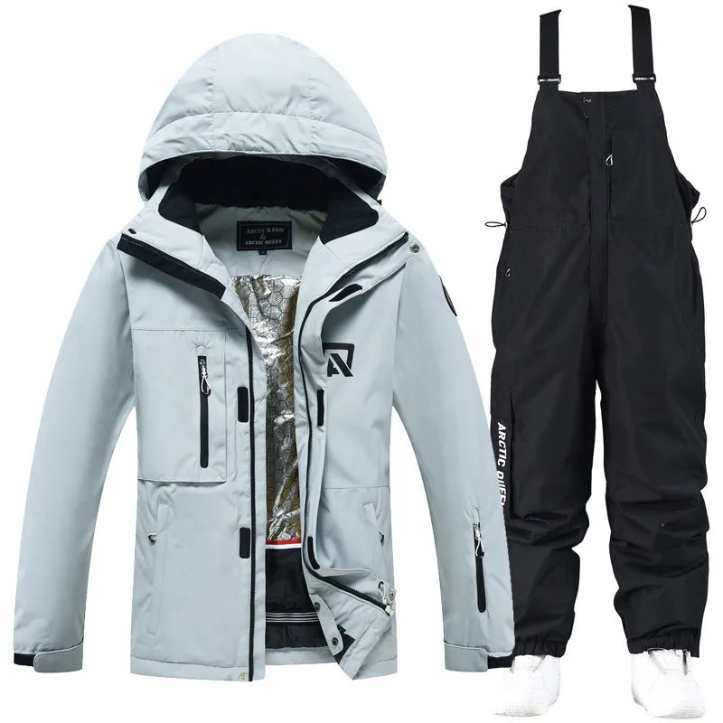 Men's and women's waterproof winter ski suit in blue top with grey blue trousers.