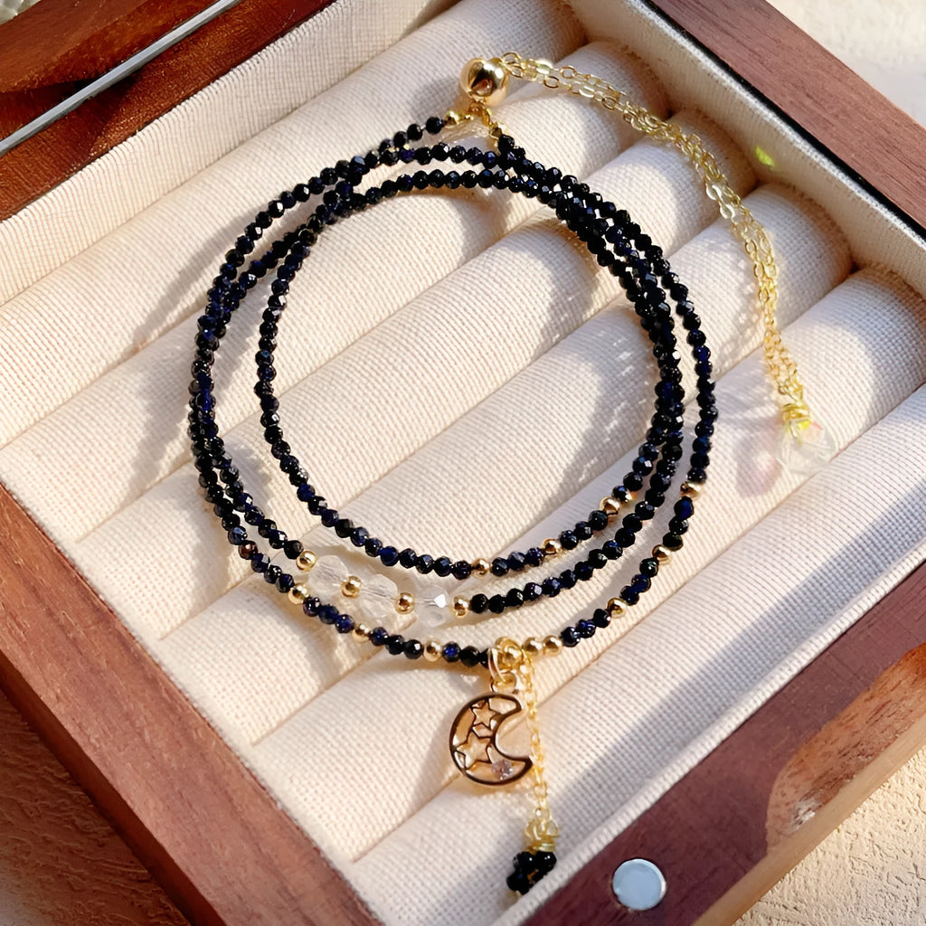 Handmade blue three-ring multi-layer bracelet for women on a wrist.