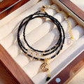 Handmade blue three-ring multi-layer bracelet for women on a wrist.
