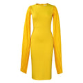 Yellow women's formal evening gown with a pleated shawl, high waist, and long sleeves on a mannequin.
