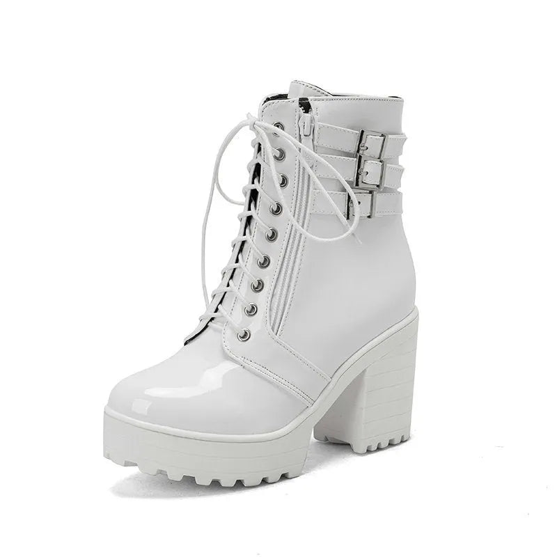 Women's black thick-heel ankle boots with round toe and front lace-up design.