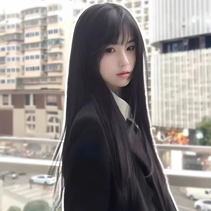 Long straight synthetic wig on a stand, shown in black colour with a full fringe.