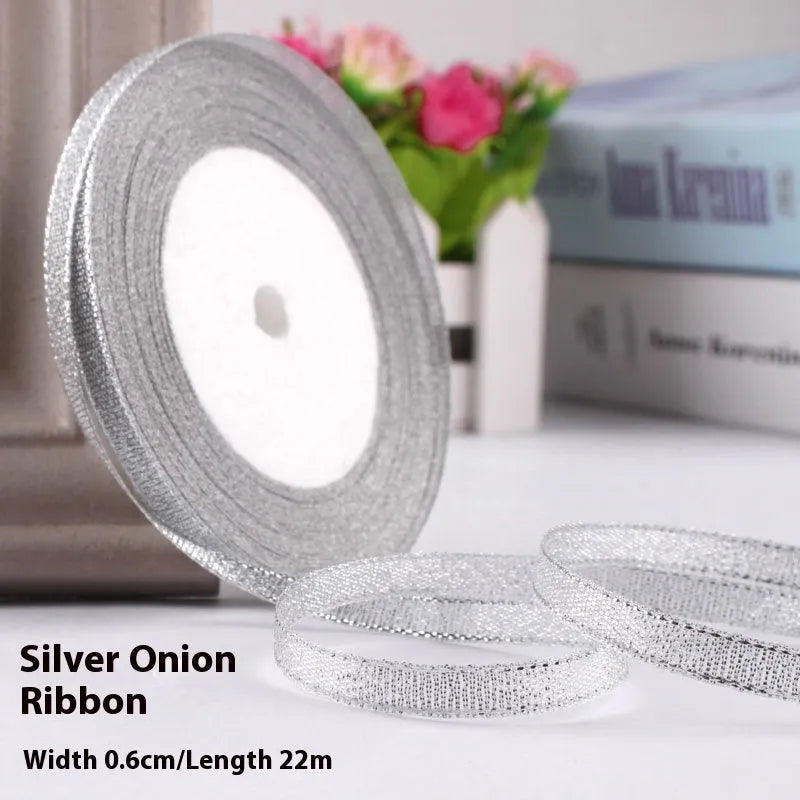 Roll of 0.6cm wide coloured polyester gift ribbon with 22 metre length.