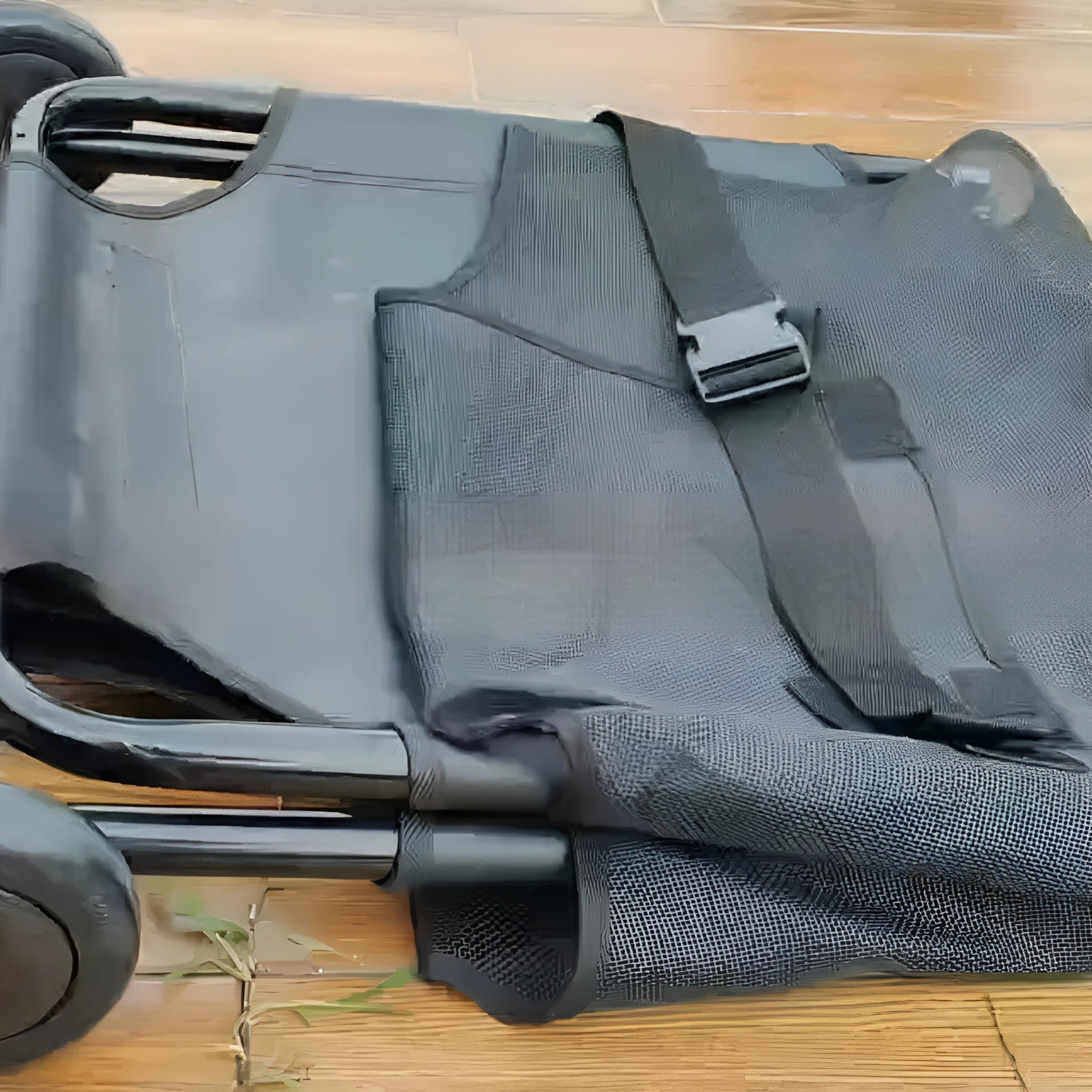 Large black foldable aluminium alloy pet stretcher for dogs laid flat.