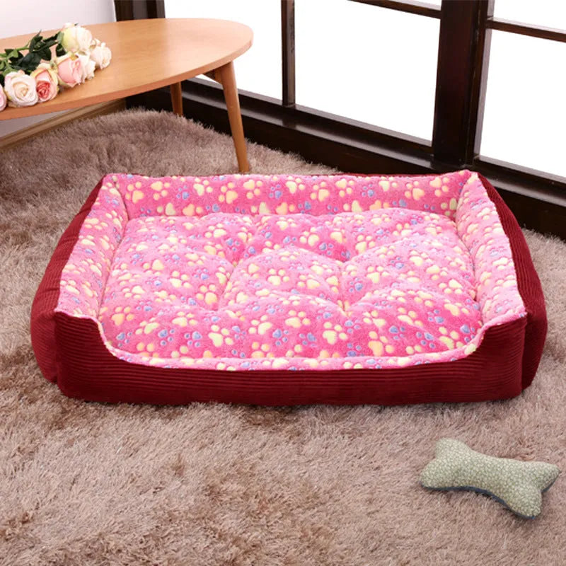 Camel coloured plush dog bed with sofa-style bolsters for small dogs, shown in Large 70x55cm size