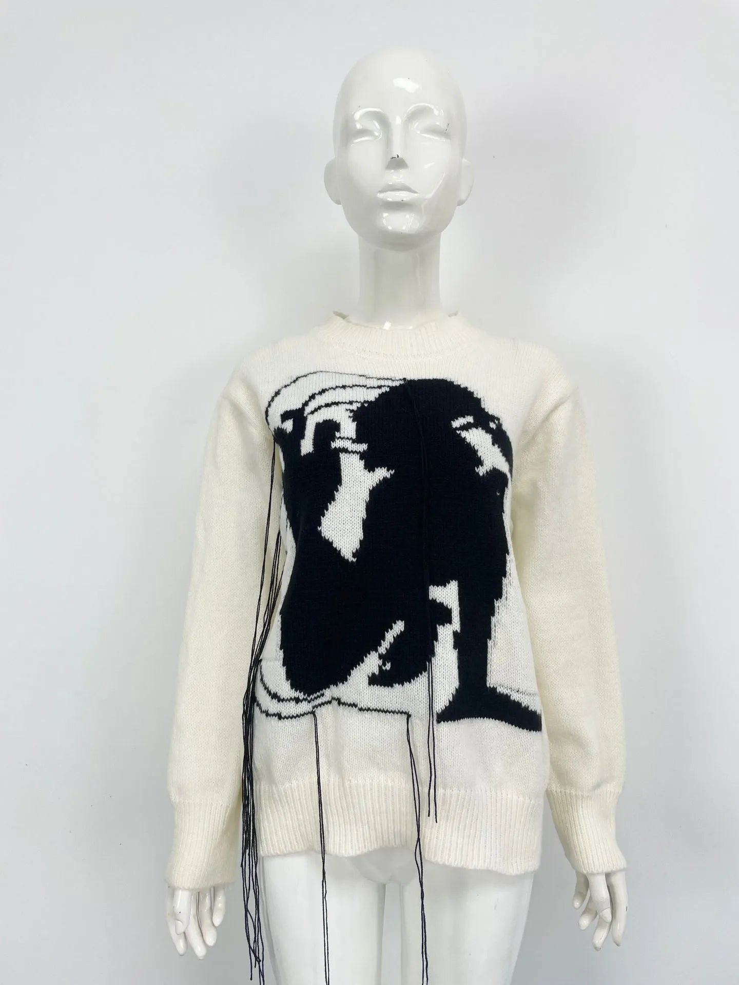 Women's loose fit alpaca wool sweater with tassel design and abstract pattern in street fashion style