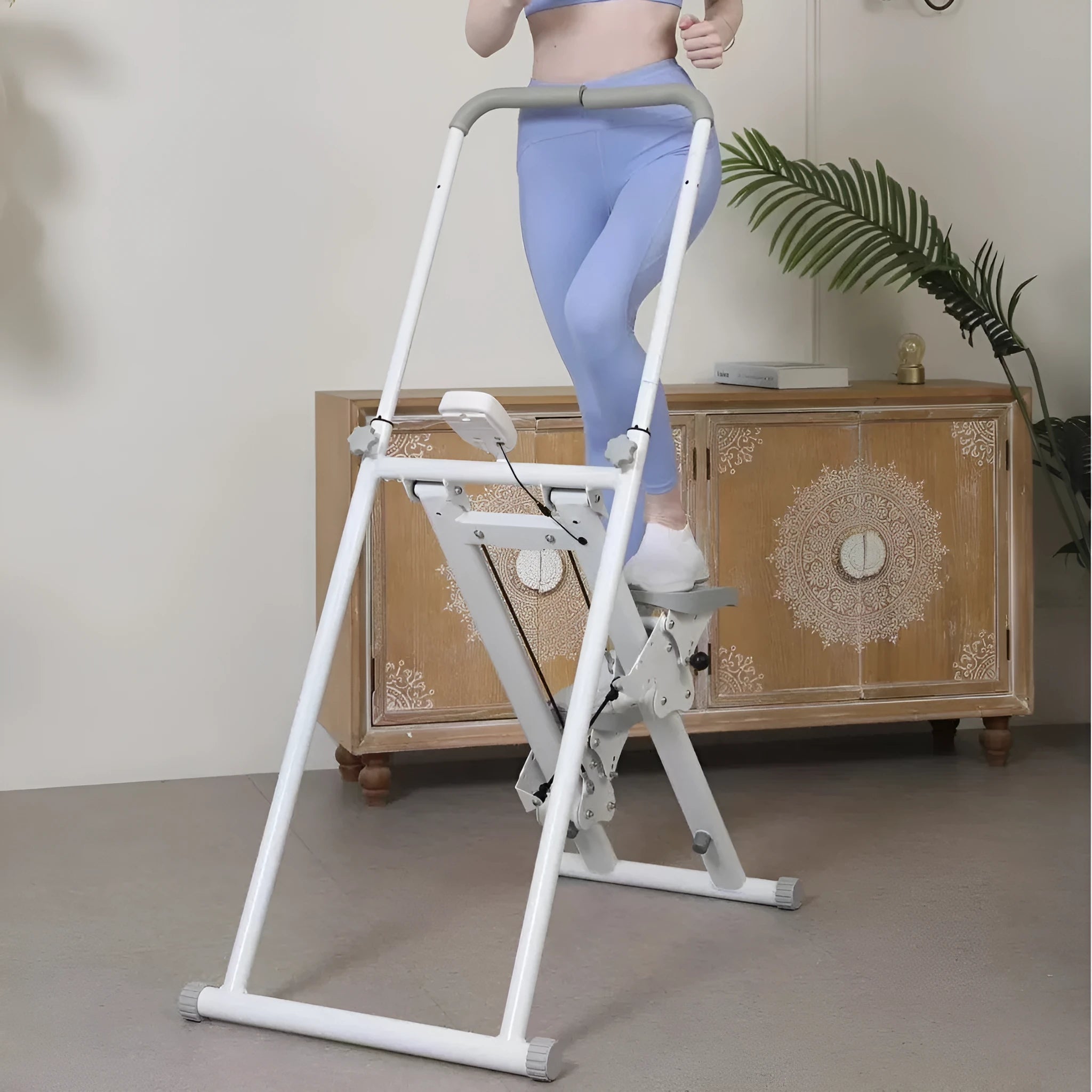 White foldable home treadmill with integrated climbing frame folded for compact storage
