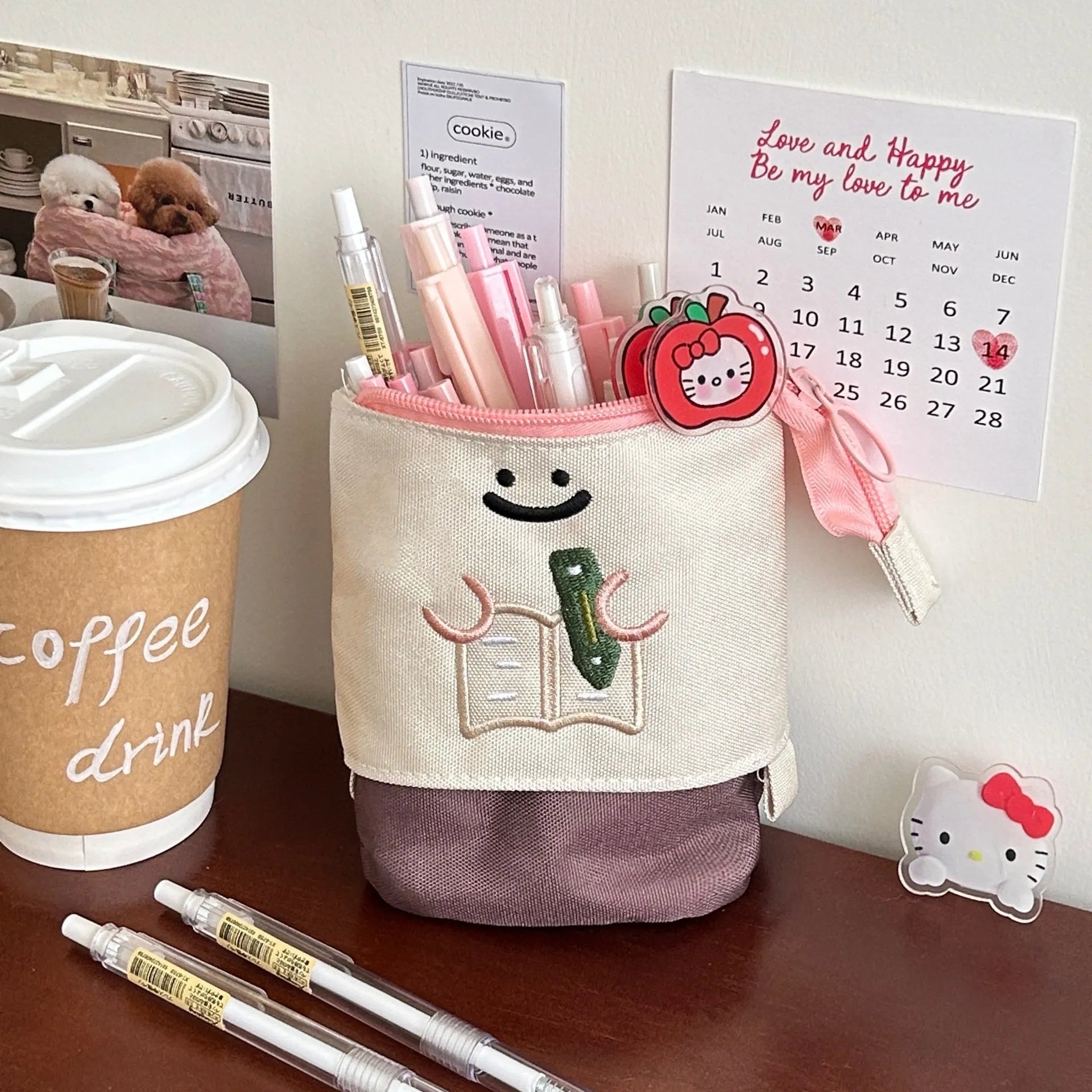Brown and green cartoon-style collapsible Oxford cloth pencil case showing zip and 17x14cm size.
