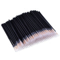 One hundred black disposable eyeliner brushes with fine pointed tips and clear plastic sleeves.