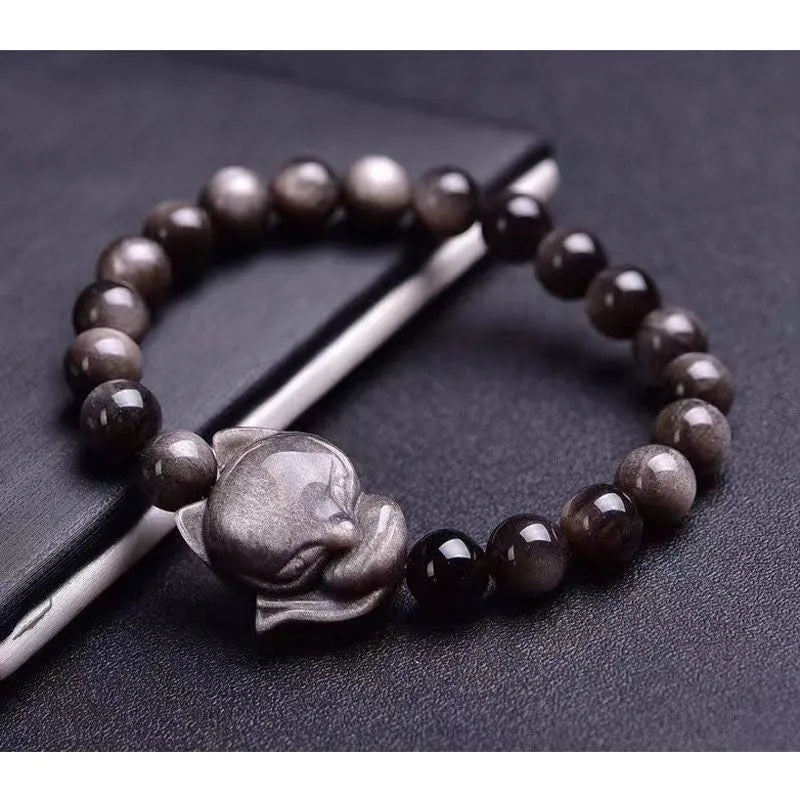 Obsidian fox bracelet with 8mm polished beads and silver fox charm on wrist