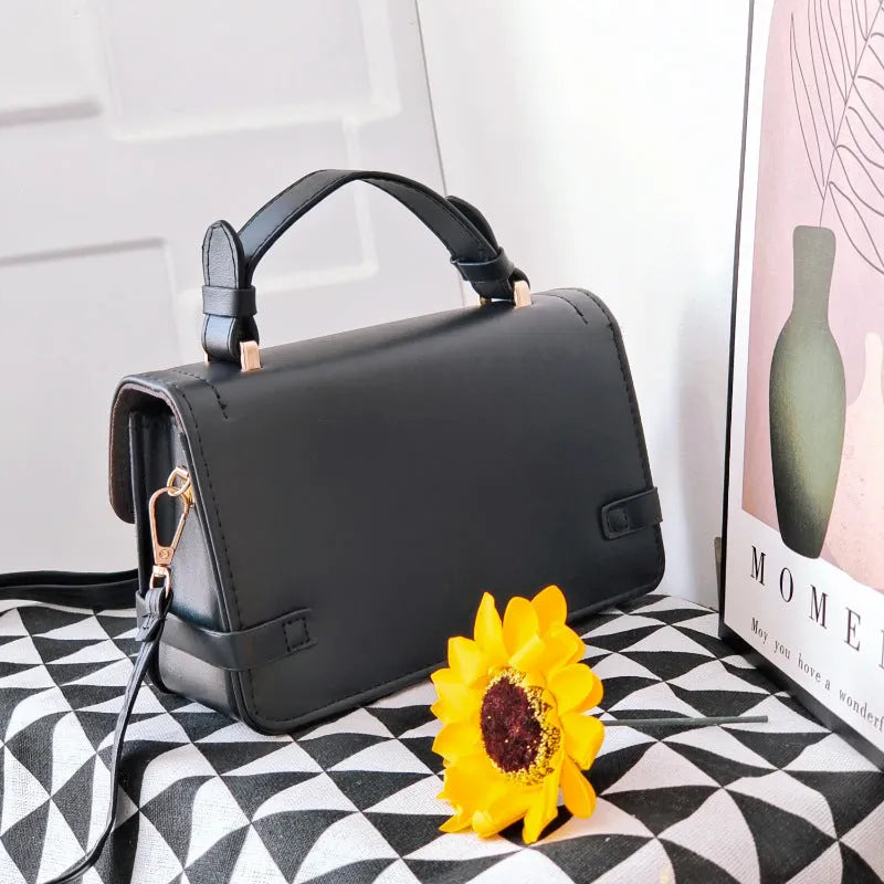 Brown ethnic pattern square crossbody bag with file compartment and structured PU build