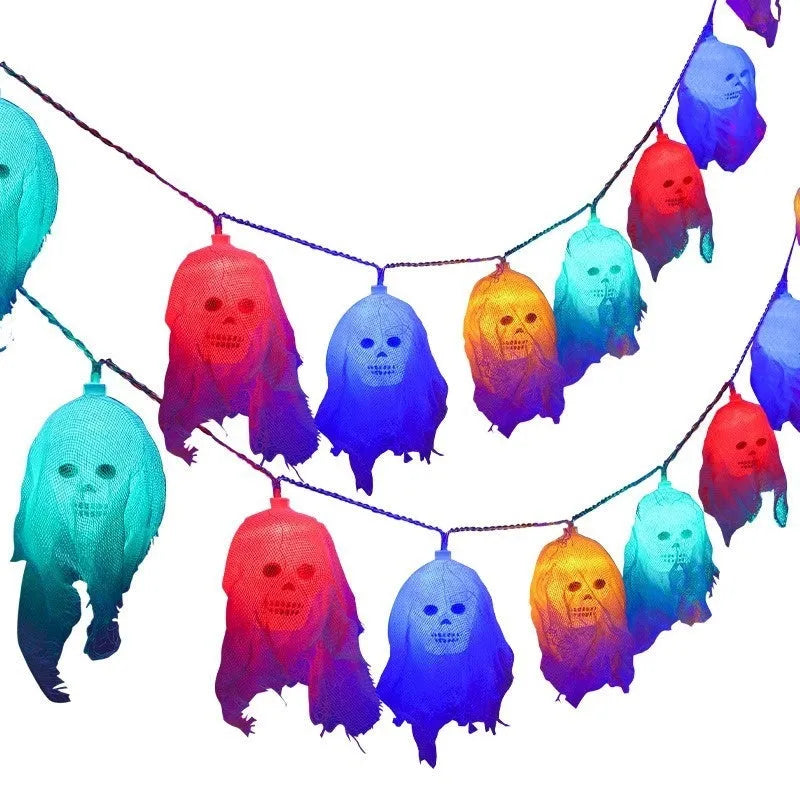 Battery-powered Halloween coloured LED string lights with plastic shell for indoor wall decoration.