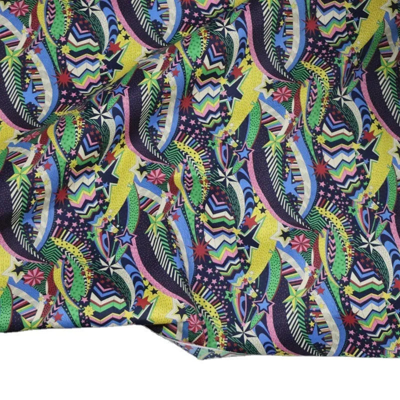 Blue floral print cotton fabric showing botanical designs on 145cm wide material