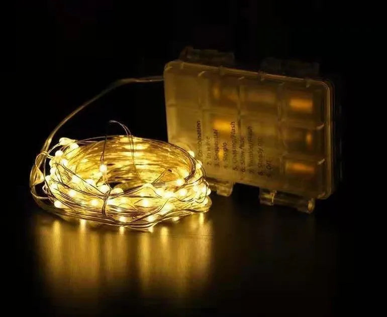12 metre copper wire LED string lights with 120 bulbs in battery-powered light post