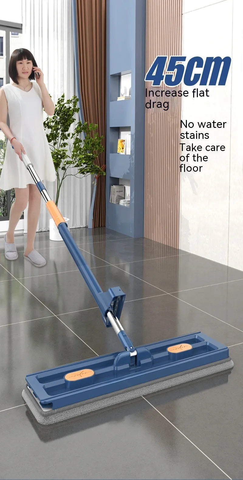 Large flat mop with blue cloth on a wooden floor, showing its 360-degree rotating head and long stainless steel handle.