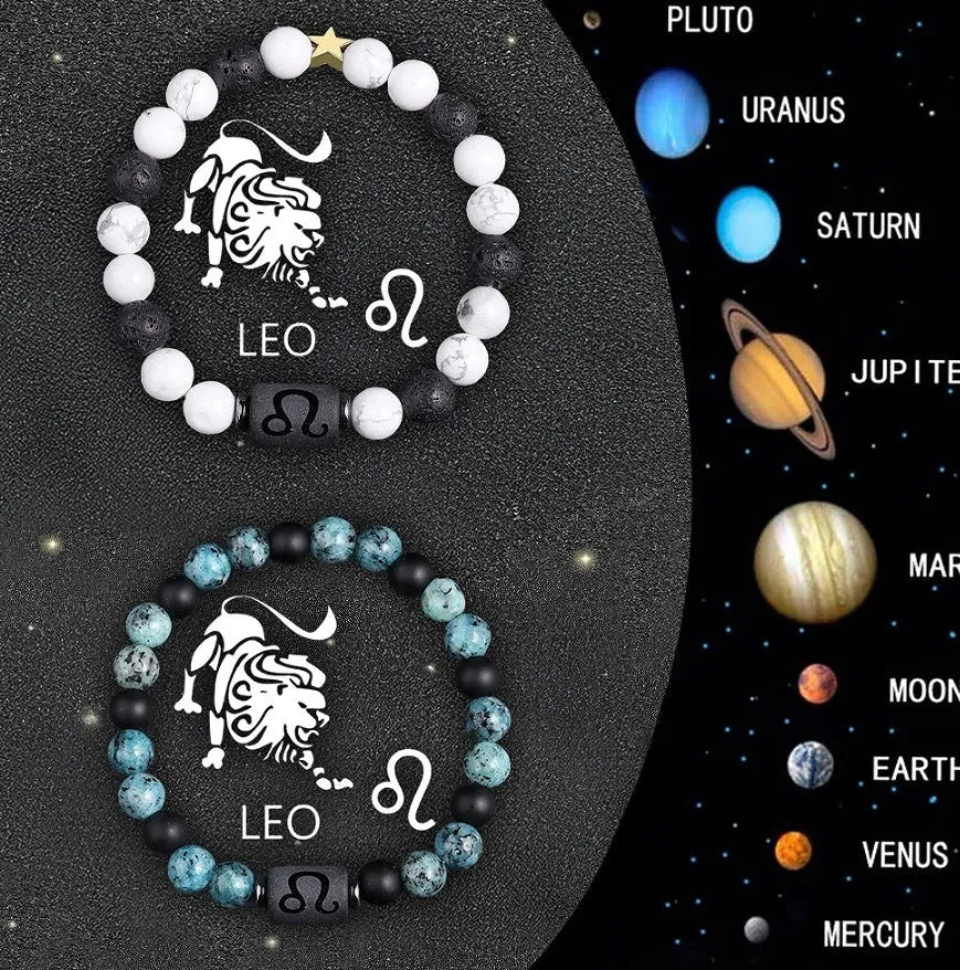 Two natural stone beaded zodiac bracelets with adjustable strings on wooden surface