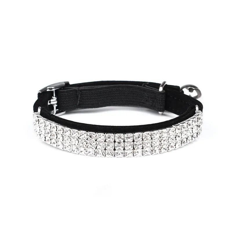 A red velvet cat collar with rhinestones on an adjustable band.